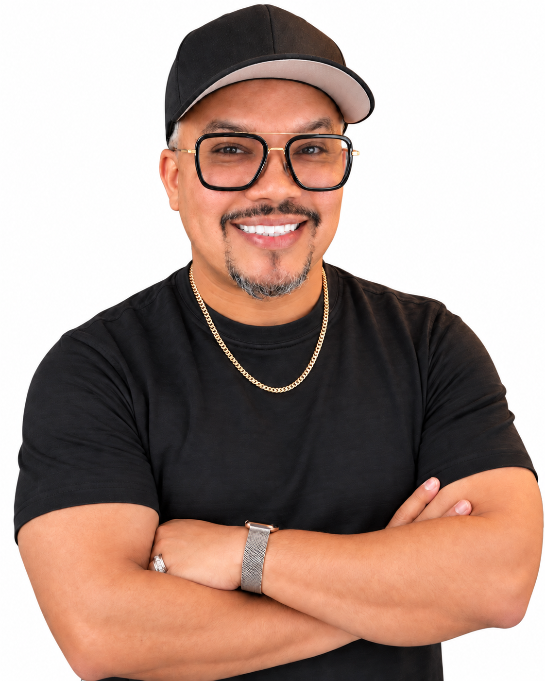 David Medina smiling with arms crossed, wearing a black hat, black shirt, glasses, and gold chain
